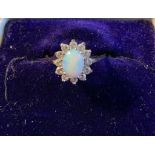 Opal and diamond cluster ring with 9ct mount
