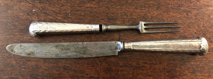 Silver handled carving knife and fork with Beverley crest of a beaver