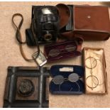 Three pairs of gold coloured metal framed spectacles with Agfa box camera, inkwell, vesta case, etc.