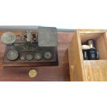 A Hakins boxed microscope, brass postal scales, S Mordan & Co and a tally or pay cheque from