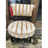 A good quality nursing chair ebonized and gilt turning to back.