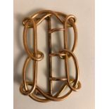 A gold dress buckle marked 9ct, 17.1gms approx.