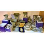 A large quantity of green Wedgwood jasperware items, some with boxes.