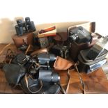 Various cameras, military binoculars, cine cameras, filters to include Rollsmat, Kodak, Yashica,