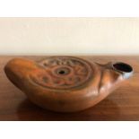 Roman pottery oil lamp, 11cms length approx, good condition.