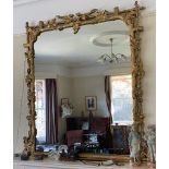 A 19thC large wooden overmantel mirror.