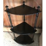 An ebonized corner wall shelf, 65cms h.