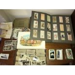 A large quanity of cigarette cards, some loose to include Allied Army Leaders, Military Motors,