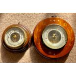 Two aneroid barometers, 1 oak, crack to glass, 1 inlaid mahogany,