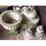 Three reconstituted stone urns.