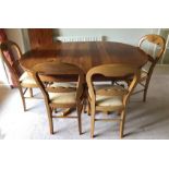 Cherry wood extending dining table and six chairs including 2 x fabric covered. 194cms fully