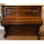Mahogany inlaid piano with Art Nouveau candle sconces.
