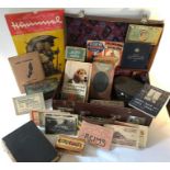 Miscellany comprising vintage suitcase, Hummel calendar, travel postcards, tins etc.