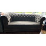 A vintage button backed chesterfield sofa approx. 202 cms wide