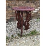 Indian carved wooden side table with dragon decoration.