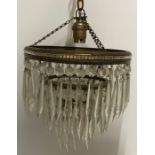 Three tier gilt hanging lamp with cut glass drops.