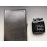 An engine turned silver cigarette case 5.17 ozt together with Siam silver lighter.
