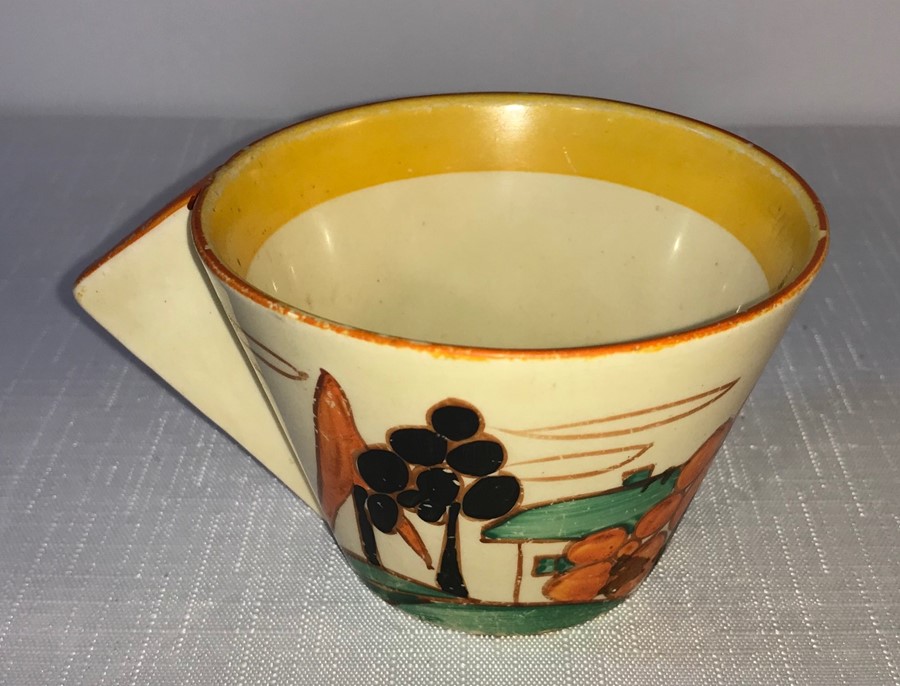 CLARICE CLIFF FOR NEWPORT FANTASQUE BIZARRE. House and tree pattern coffee cup with triangular