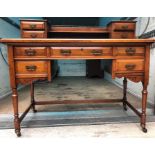 Mahogany leather topped writing table with brass gallery top. 110w x 52 cms d