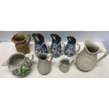 Eight various moulded 19thC jugs including set of 3 with pewter tops.