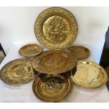 Seven various brass plates including les buveurs.