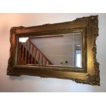 Bevell edged gilt framed wall mirror. 83cms x 138cms.
