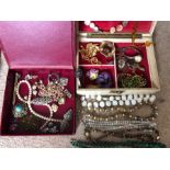A quantity of costume jewellery including silver in two boxes.
