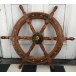 Lawrence Simpson mahogany and brass ships wheel. 77cms w.