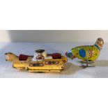 Corgi yellow submarine and wind up tinplate hen.