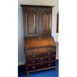 Early 18thC bureau bookcase on bun feet. 204cms h, 88cms w, 61cms d.