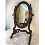 Oval framed inlaid toilet mirror.