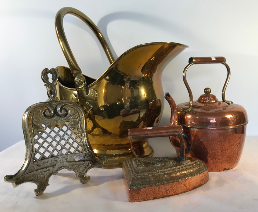 Brass coal helmet and trivet stand, copper kettle and iron.