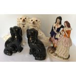 Two pairs of 19thC Staffordshire dogs and a Staffordshire flat back figural group, 33cms h, repair