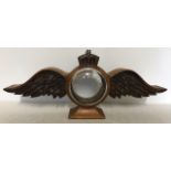 Oak clock case in the form of RAF wings with crown to top.