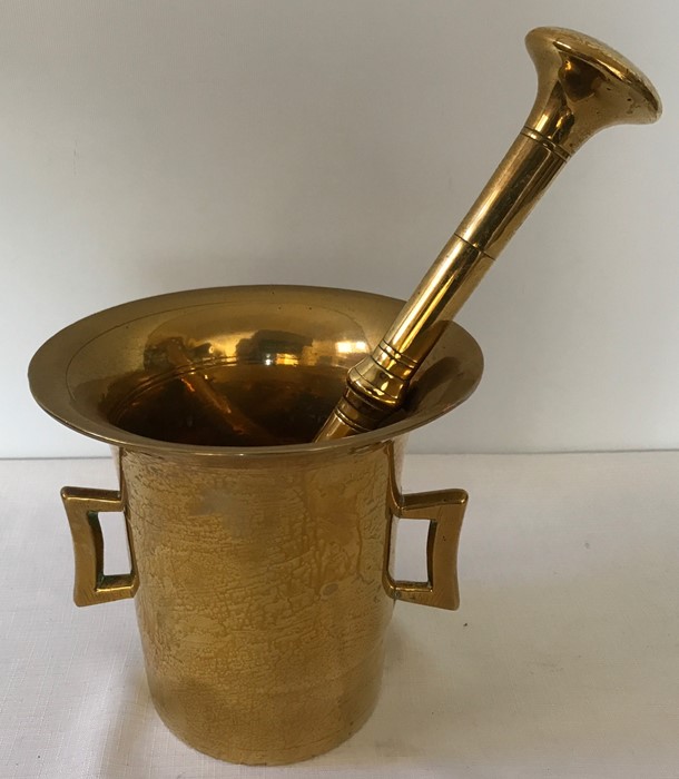 Brass pestle and mortar circa 1800. 17cms h.