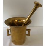 Brass pestle and mortar circa 1800. 17cms h.