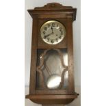 Oak cased pendulum wall clock.