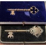 Two ceremonial silver keys in cases