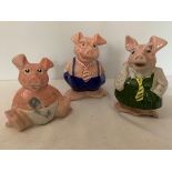 Three Nat West pigs