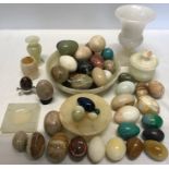 A collection of alabaster eggs, fruit bowl etc.