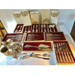 Large quantity of viners silver plated cutlery in boxes together with silver plated sugar helmet,