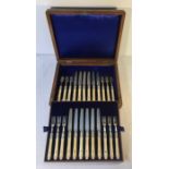 Boxed silver and ivory dessert knives and forks in a fitted oak box. Sheffield 1909.