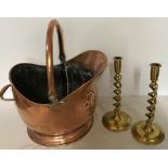 Copper coal helmet and pair of brass barley twist candlesticks. 31cms h.