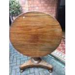 A 19thC circular tip top table 91cms d.