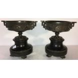 Pair bronze urns with relief figures of reclining ladies. 20cms h.