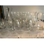 A large quantity of good quality engraved glassware including jugs, decanters and numerous glasses