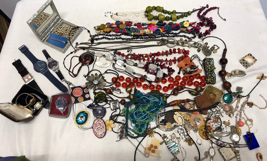 A large quantity of vintage costume jewellery including Swatch watches, necklaces, earrings etc.