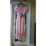 Early 1980's bridesmaid dress, pink satinised fabric, lace trim. Matching flower and crystal