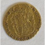 A George III gold quarter guinea 1762. 2.1g