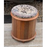 Oak circular stool with upholstered top.